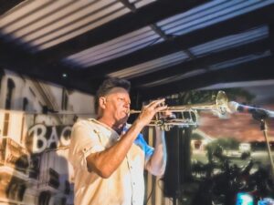 A man playing the trumpet on stage.