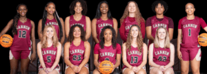 A group of girls in maroon jerseys holding a basketball.