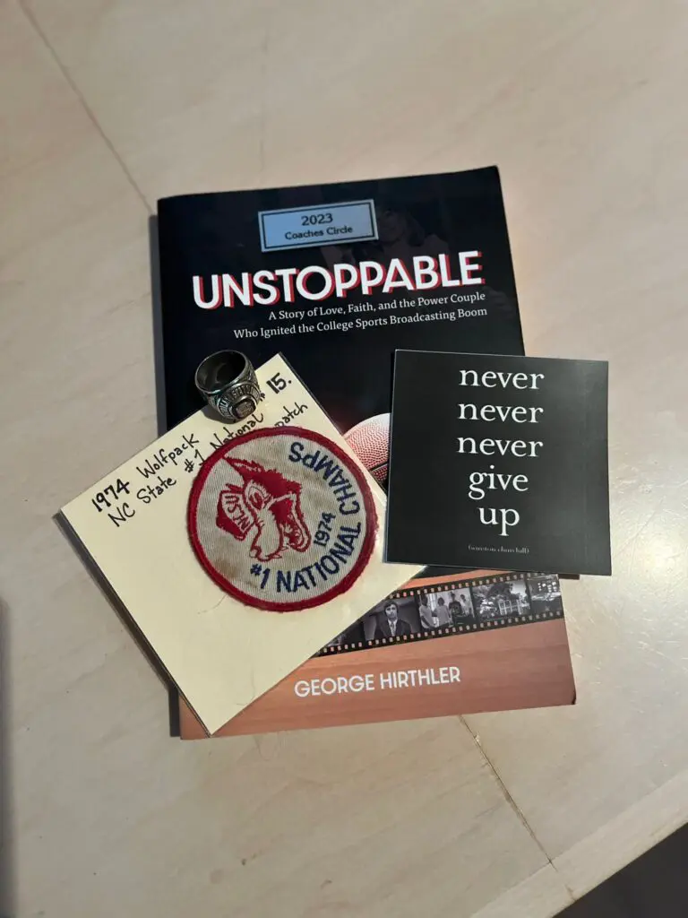 A book, patch and other items are on the table.